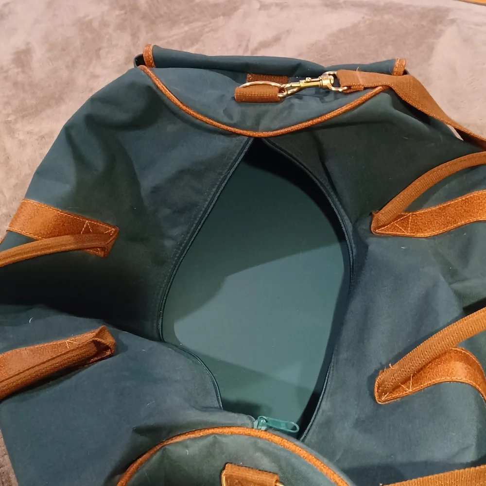 Duffle bag fancy straps are nice accents to this bag